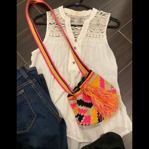 Vibrant colorful mini boho bag with tassel ties.